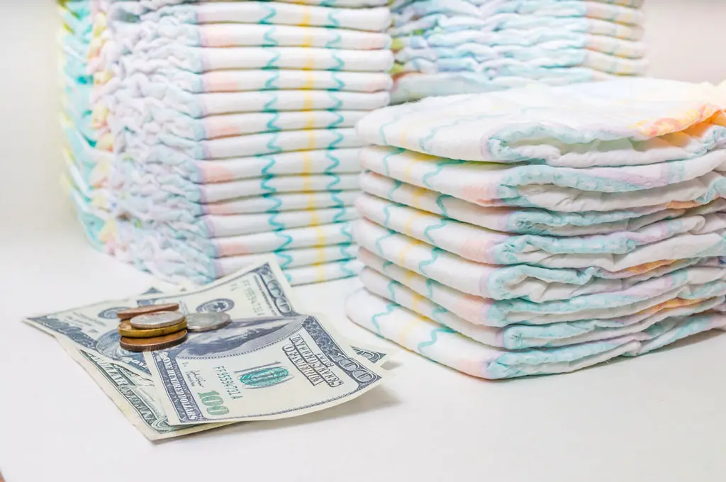 Disposable Diapers with US dollar bills and coins